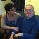 Crisely Melecio-Zambrano and Johnny Schofield discuss ways their home in D.C. can support L'Arche in Latin America. Johnny suggested keeping a container in the living room to collect spare change. Photo by Bethany Keener